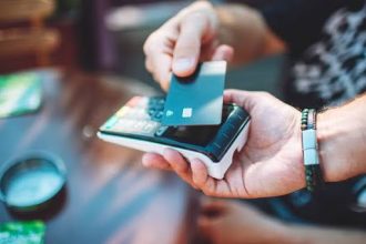 A financial analyst monitoring real-time transaction data on a digital dashboard, detecting suspicious activity for fraud prevention.